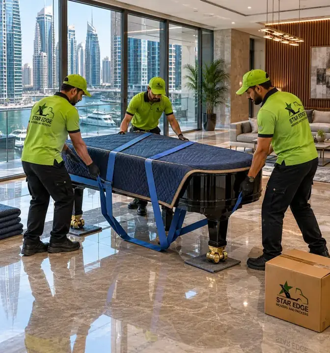 Star Edge crew moving a protected piano in a Dubai Marina apartment
