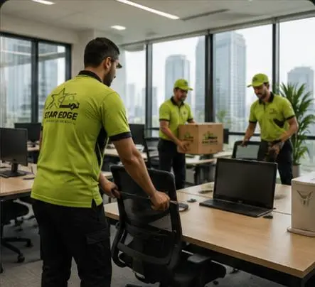Star Edge crew moving chairs and equipment in a Dubai office